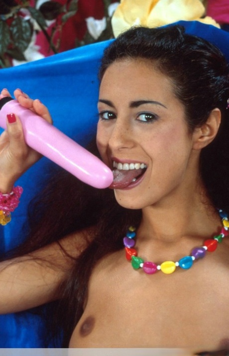 Skinny Indian MILF uncovers her boobs before sucking on a vibrator