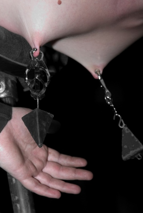 Blonde MILF Samantha Sin has her nipples weighted while in bondage