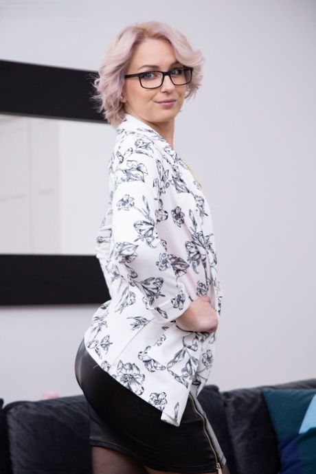 Blonde MILF in glasses Kittina Coxxx shows her twat & poses in lacy stockings