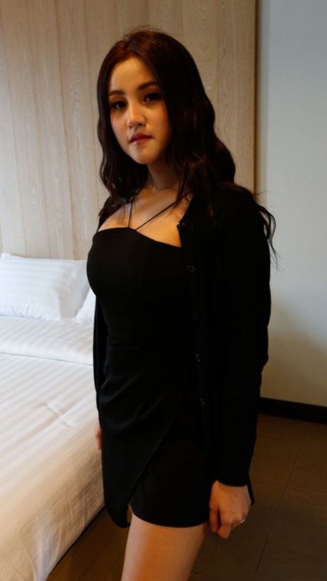 Beautiful Asian girl Zin shows her big tits while undressing for POV sex