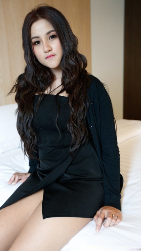Beautiful Asian girl Zin shows her big tits while undressing for POV sex